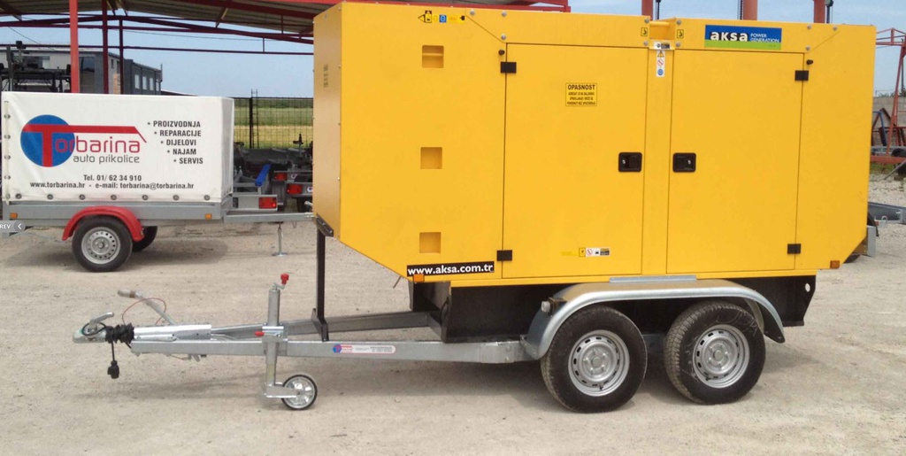 Custom tandem-axle trailer for generator transport